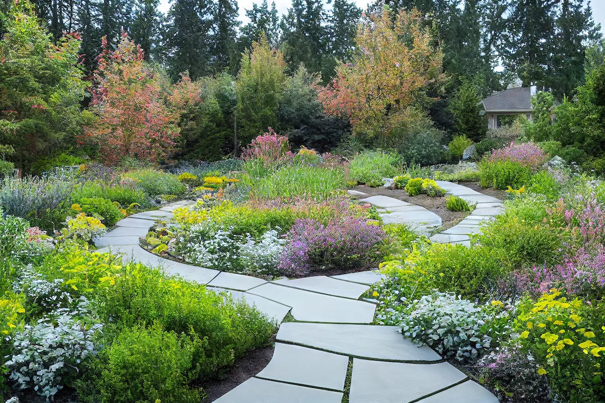 cozy-house-exterior-with-landscape-paths-with-green-flower-beds cozy-house-exterior-with-landscape-paths-with-green-flower-beds